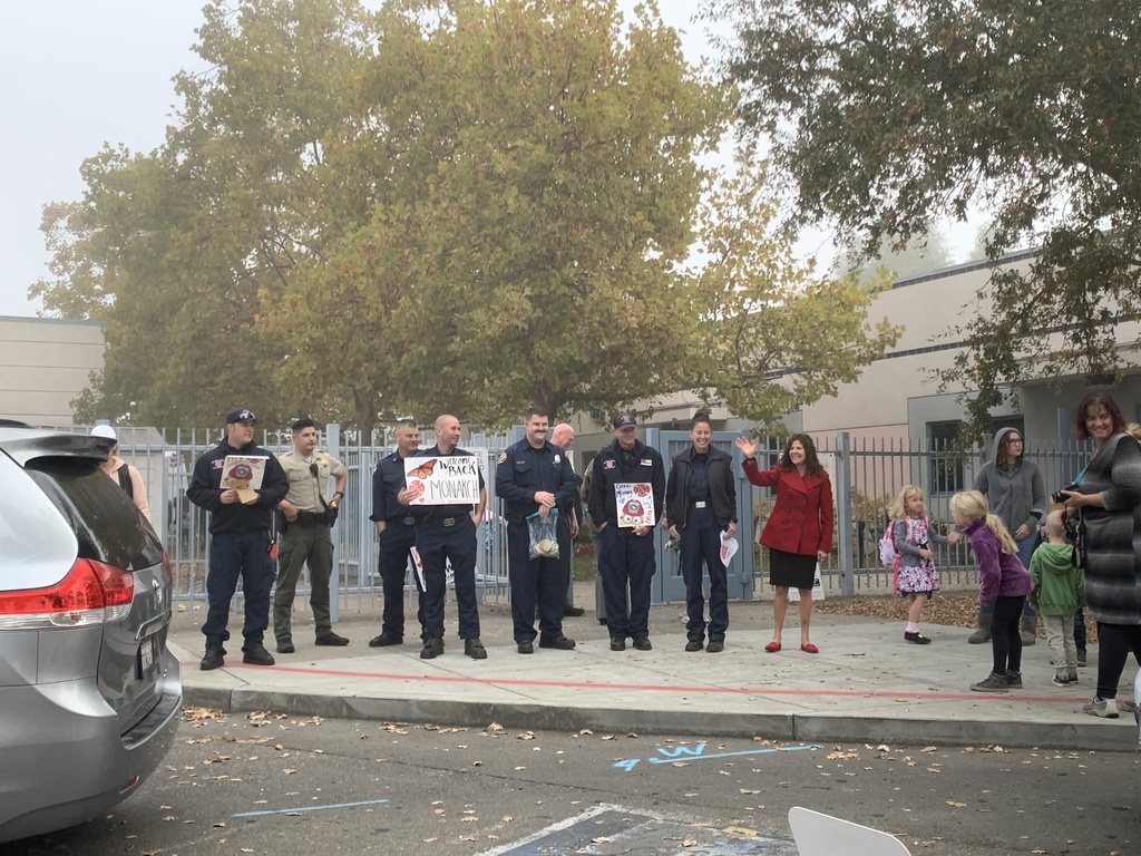 Fire Fighters, Police Officers and Principal Stearn welcoming students back